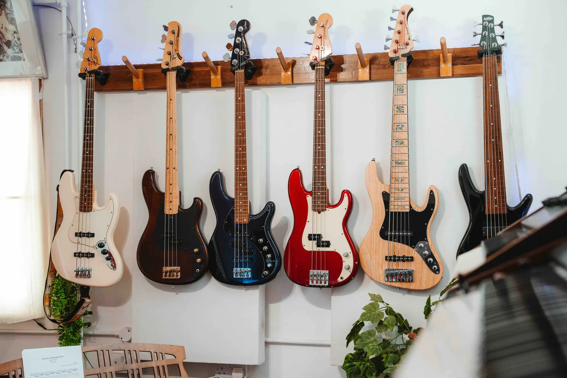 A wall of bass guitars at the studio