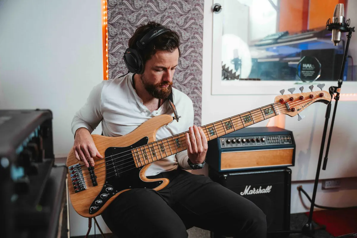 Jack tracking bass in the studio
