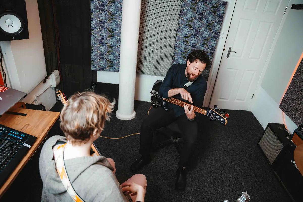 A one-to-one bass lesson in the studio